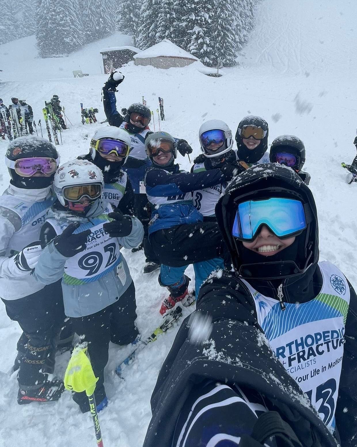 Sherwood Ski Team athletes smiling together during a snowy race day